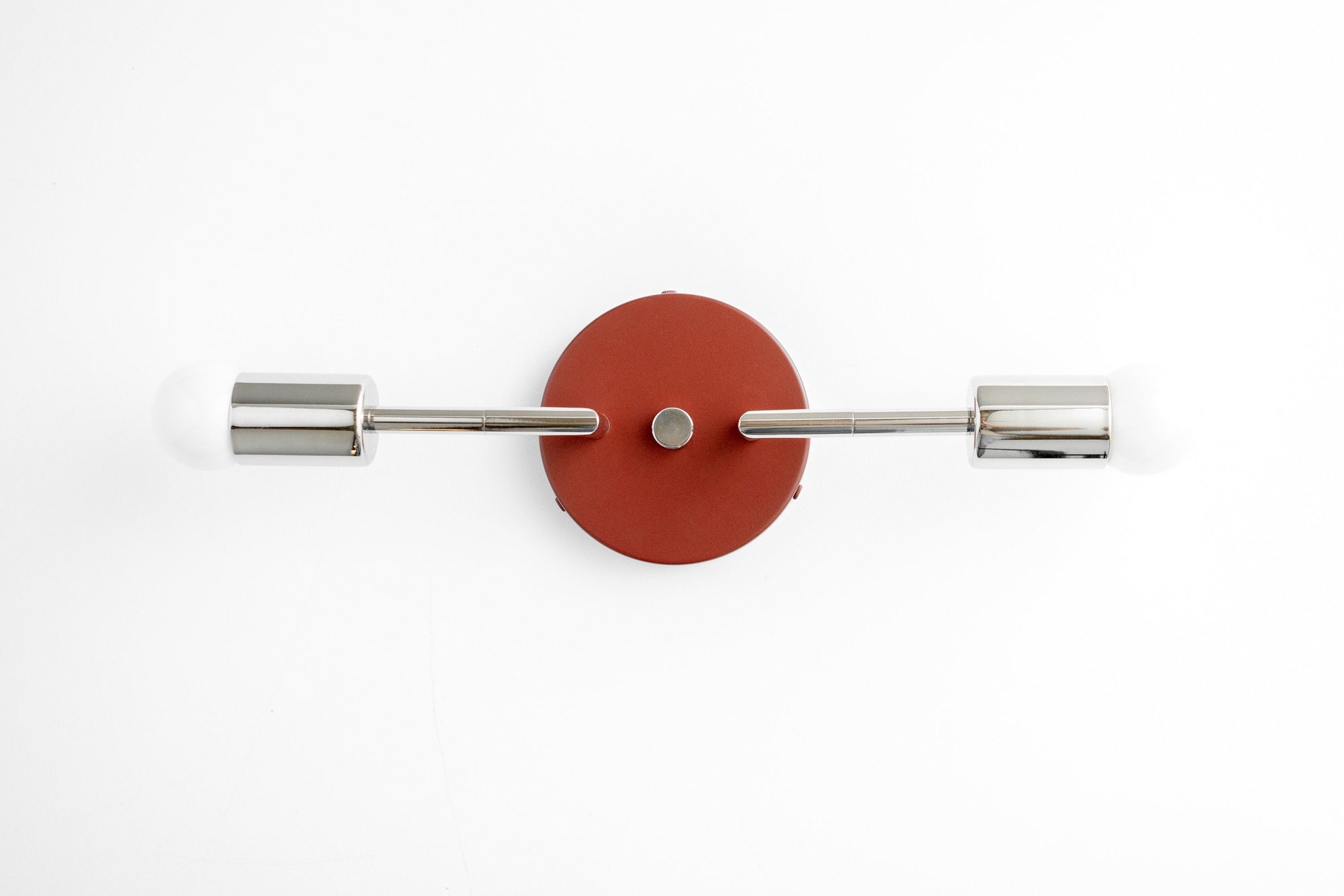 Brushed nickel two-bulb vanity light with round brick red wall mount and cylindrical fixtures. - VANITY LIGHT MODEL NO. 1938