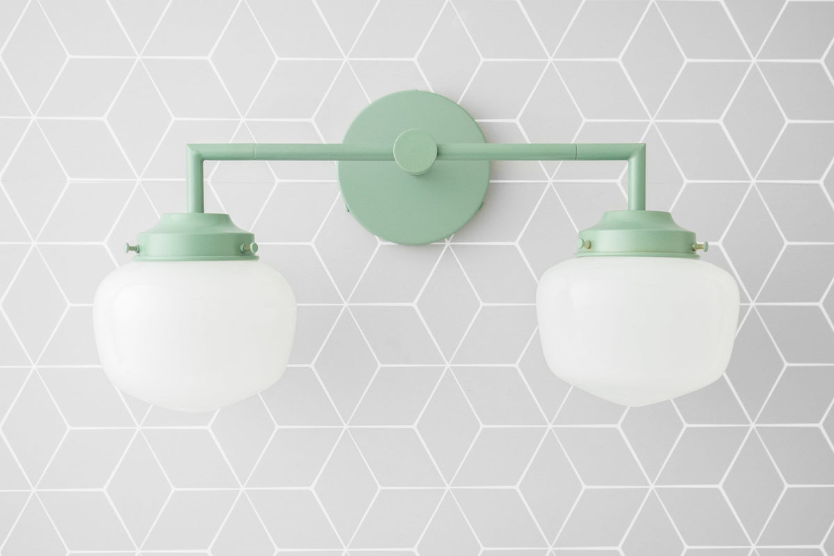 Two-bulb vanity light with matte mint green metal fixture and frosted white glass globe shades. - VANITY LIGHT MODEL NO. 0276
