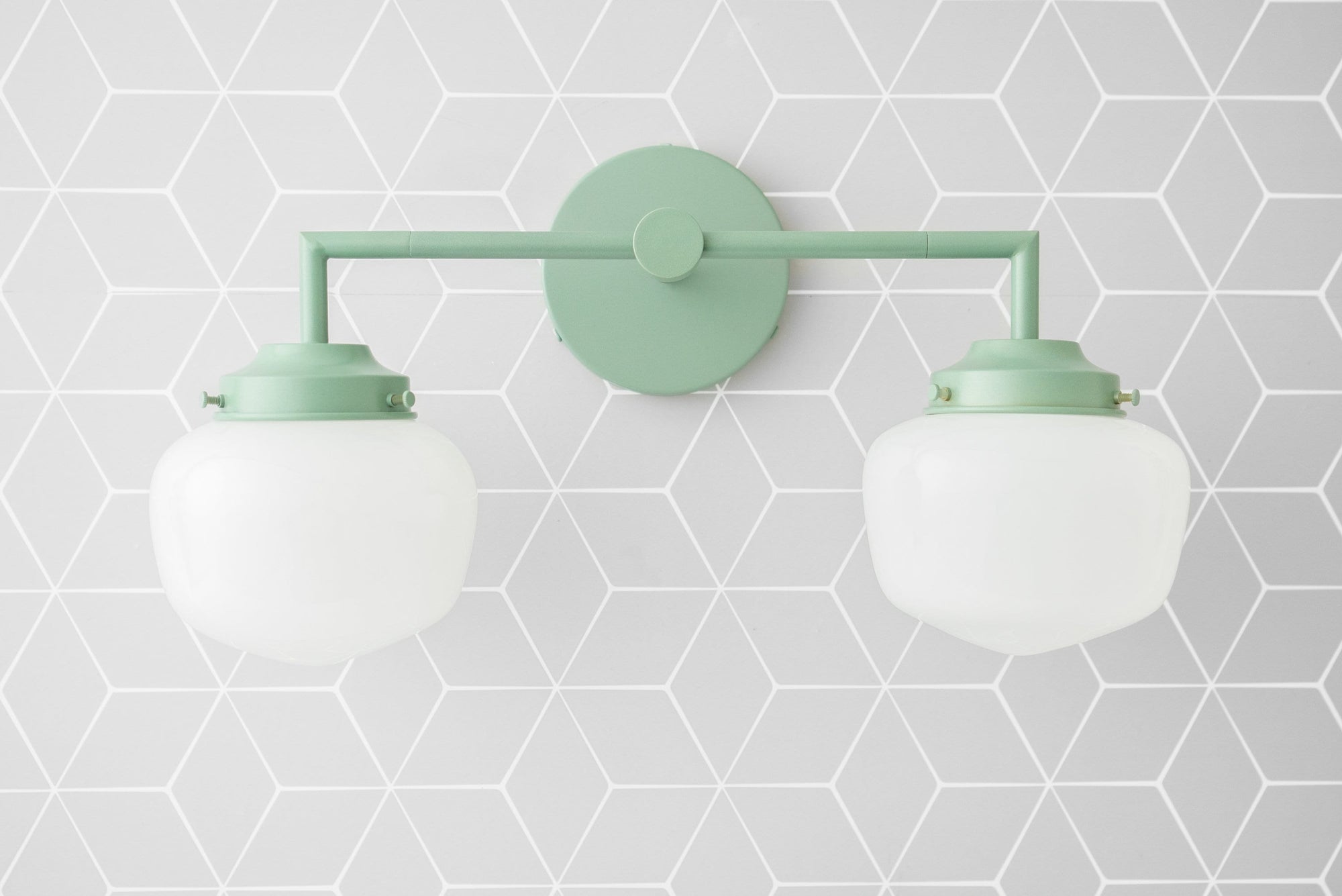 Two-bulb vanity light with matte mint green metal fixture and frosted white glass globe shades. - VANITY LIGHT MODEL NO. 0276