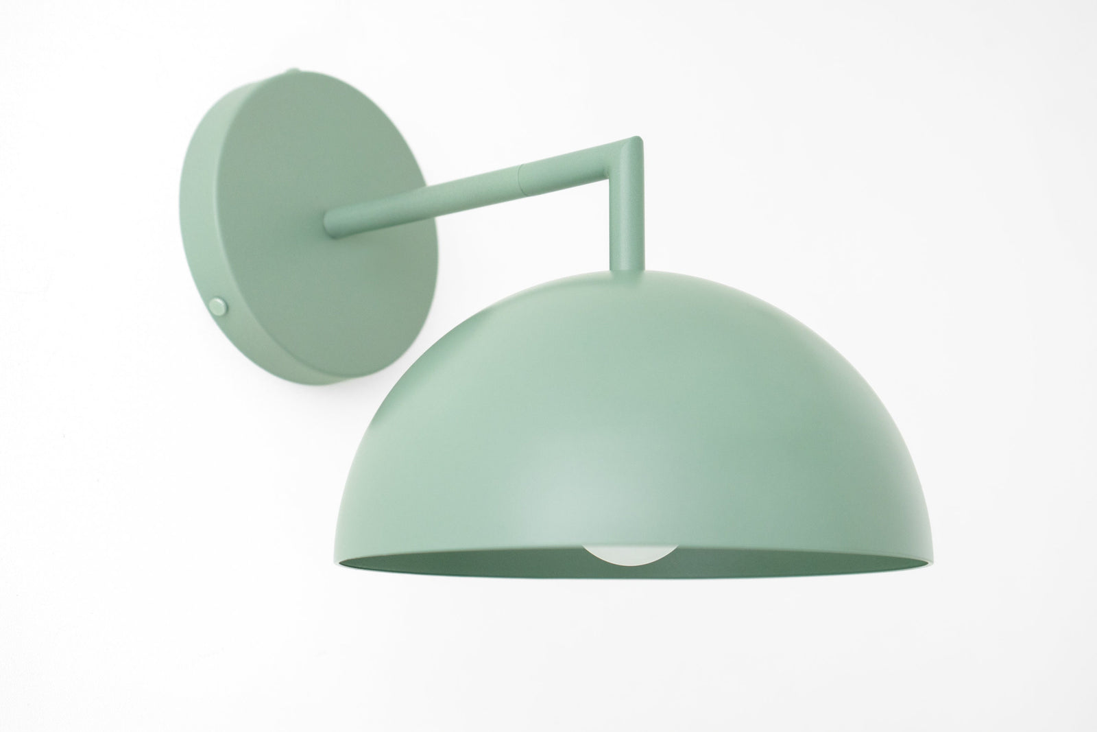 Matte sage green dome-shaped wall sconce with minimalist Scandinavian design and concealed bulb. - SCONCE MODEL NO. 6952