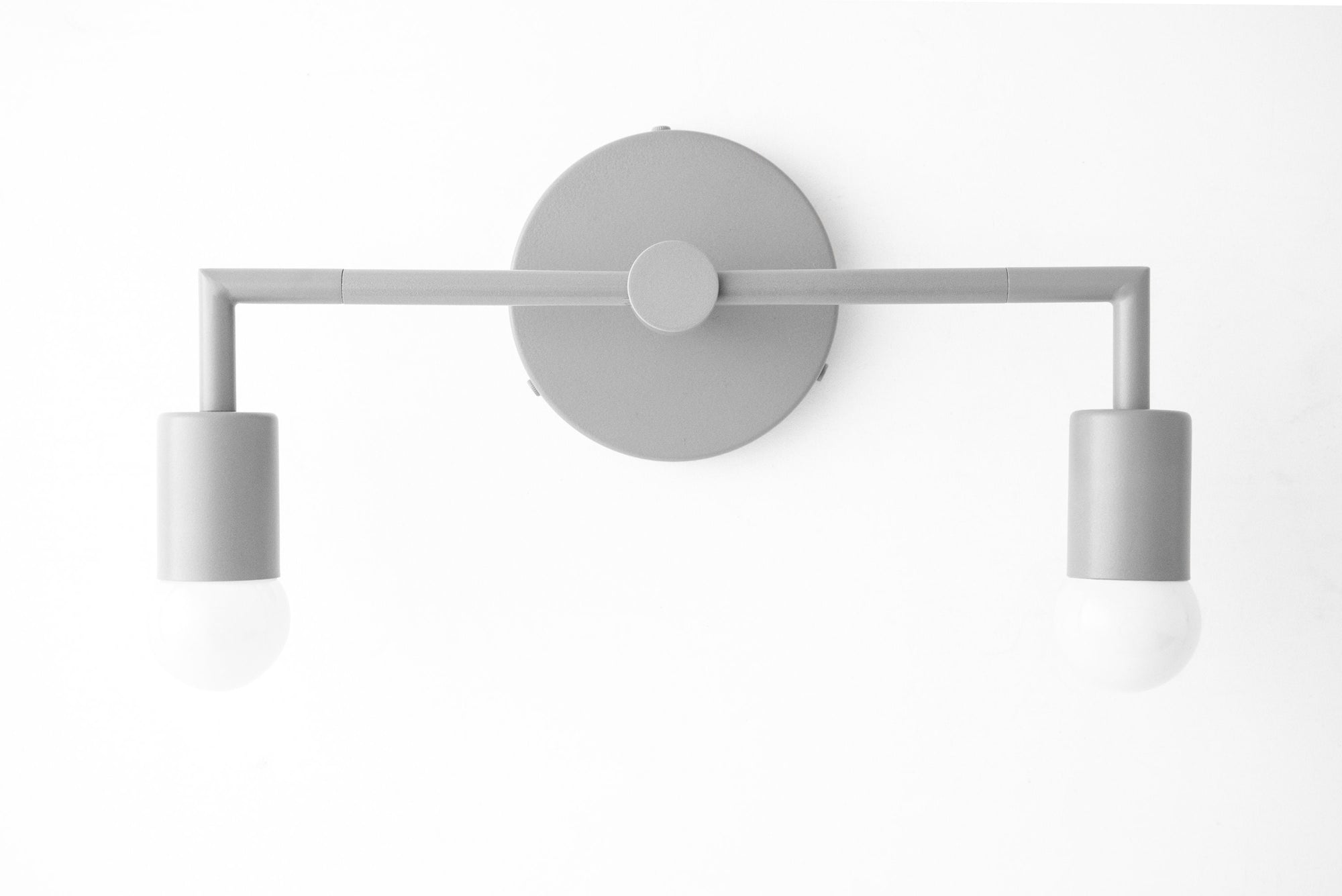 Gray Scandinavian-style vanity light with two exposed bulbs and minimalist horizontal bar design. - VANITY LIGHT MODEL NO. 1561