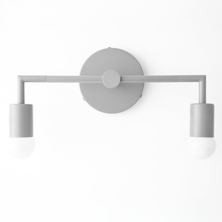 Matte gray two-bulb vanity light with cylindrical shades and round wall mount. - VANITY LIGHT MODEL NO. 1561