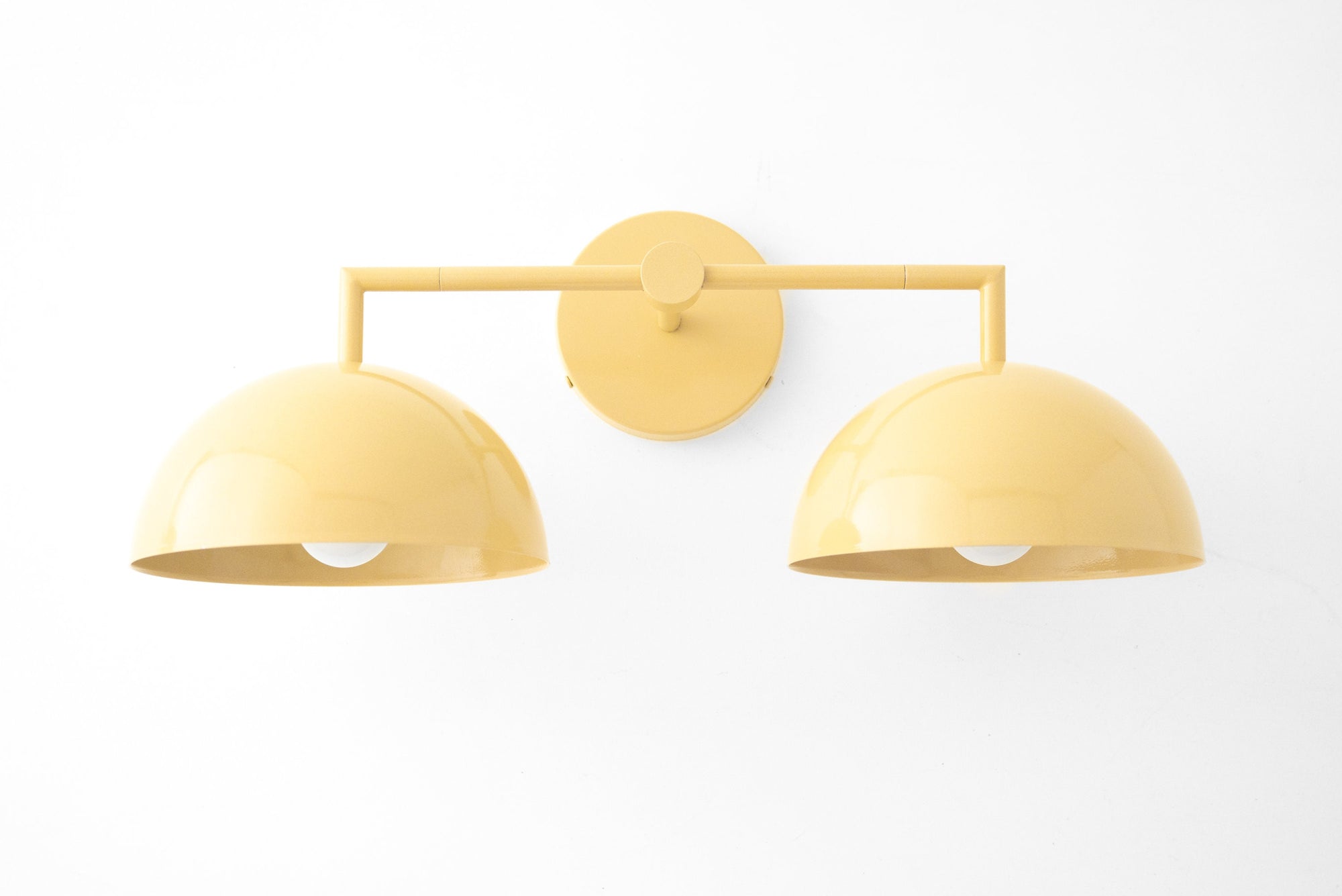 Yellow dome-shaped double vanity light with matte finish and brass mounting plate. - VANITY LIGHT MODEL NO. 6074