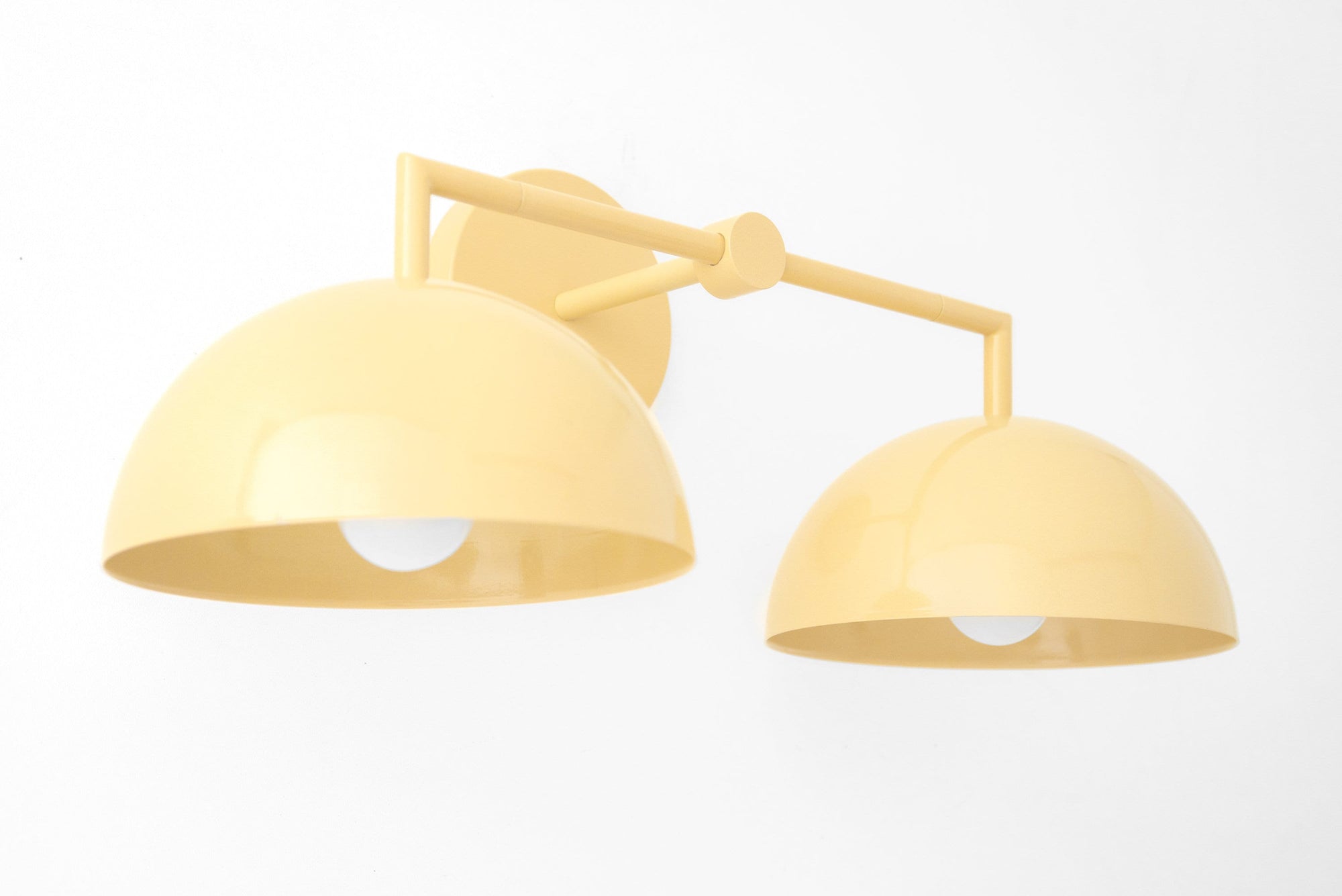 Art Deco style beige vanity light with two dome-shaped shades and exposed bulbs. - VANITY LIGHT MODEL NO. 6074
