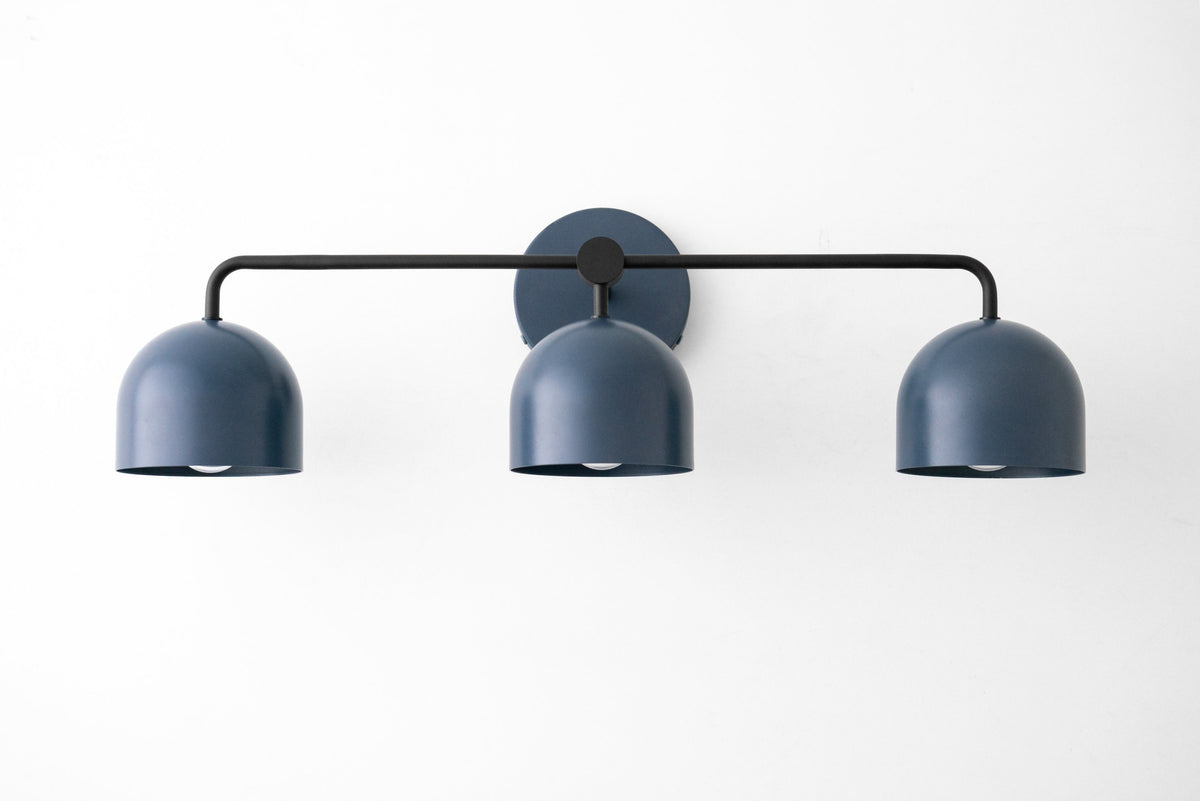 Mid-century modern 3-bulb vanity light in matte black with rounded shades and horizontal bar mount. - VANITY LIGHT MODEL NO. 7456