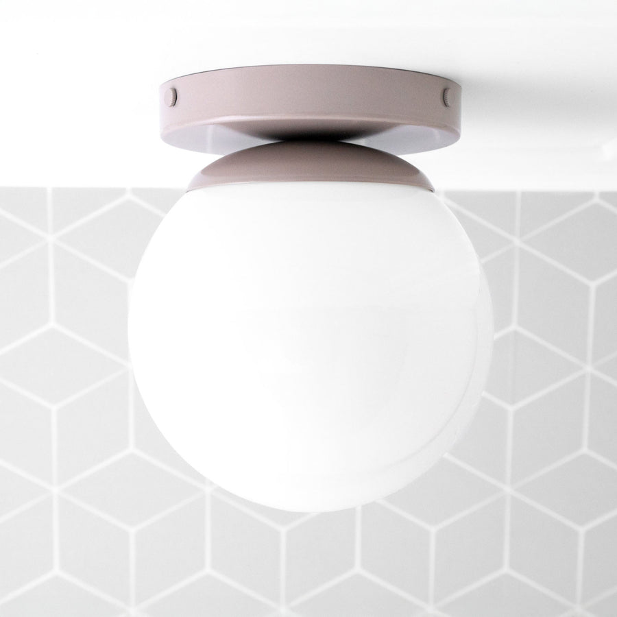 Flush mount ceiling light with mauve round metal base and frosted white globe shade. - CEILING LIGHT MODEL NO. 3825