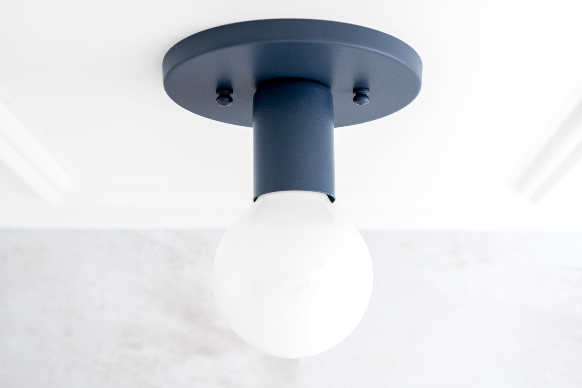 Coal blue flush mount sconce with exposed white bulb and minimalistic mid-century modern design. - SCONCE MODEL NO. 4460