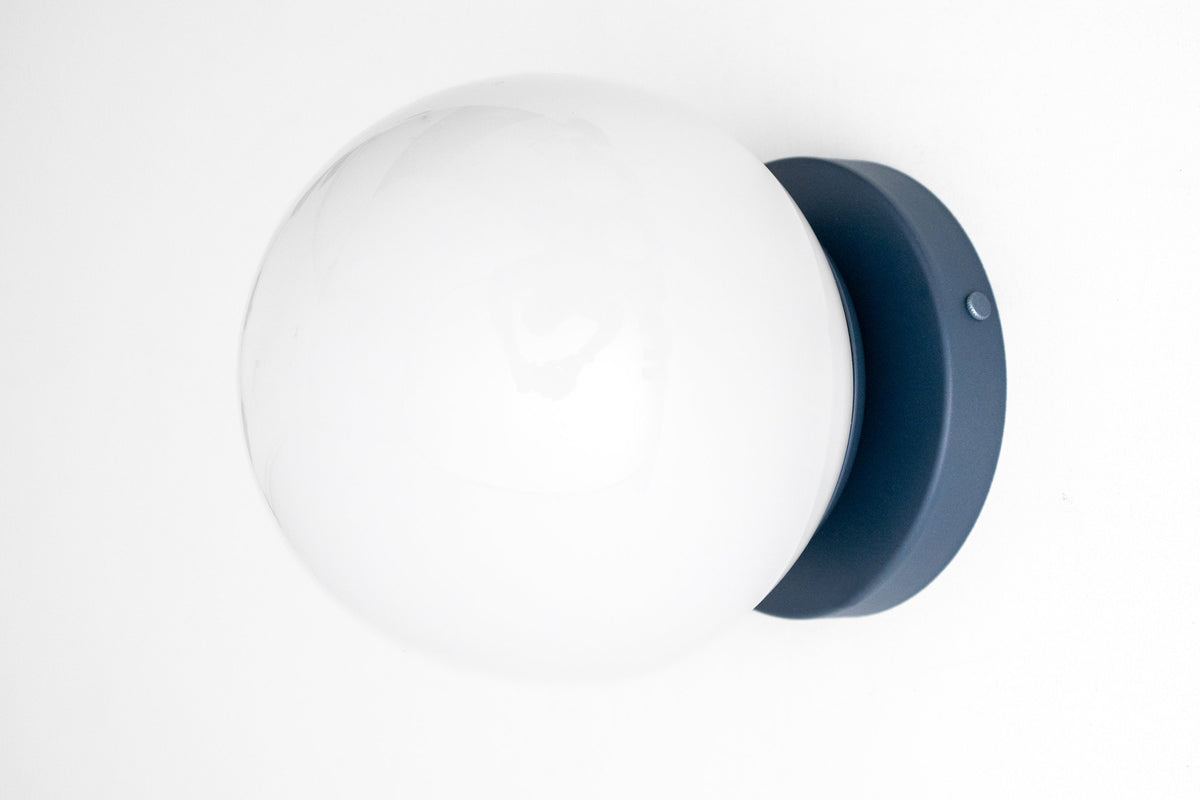 Mid-century modern wall sconce with white globe and coal blue flush mount base. - SCONCE MODEL NO. 3825