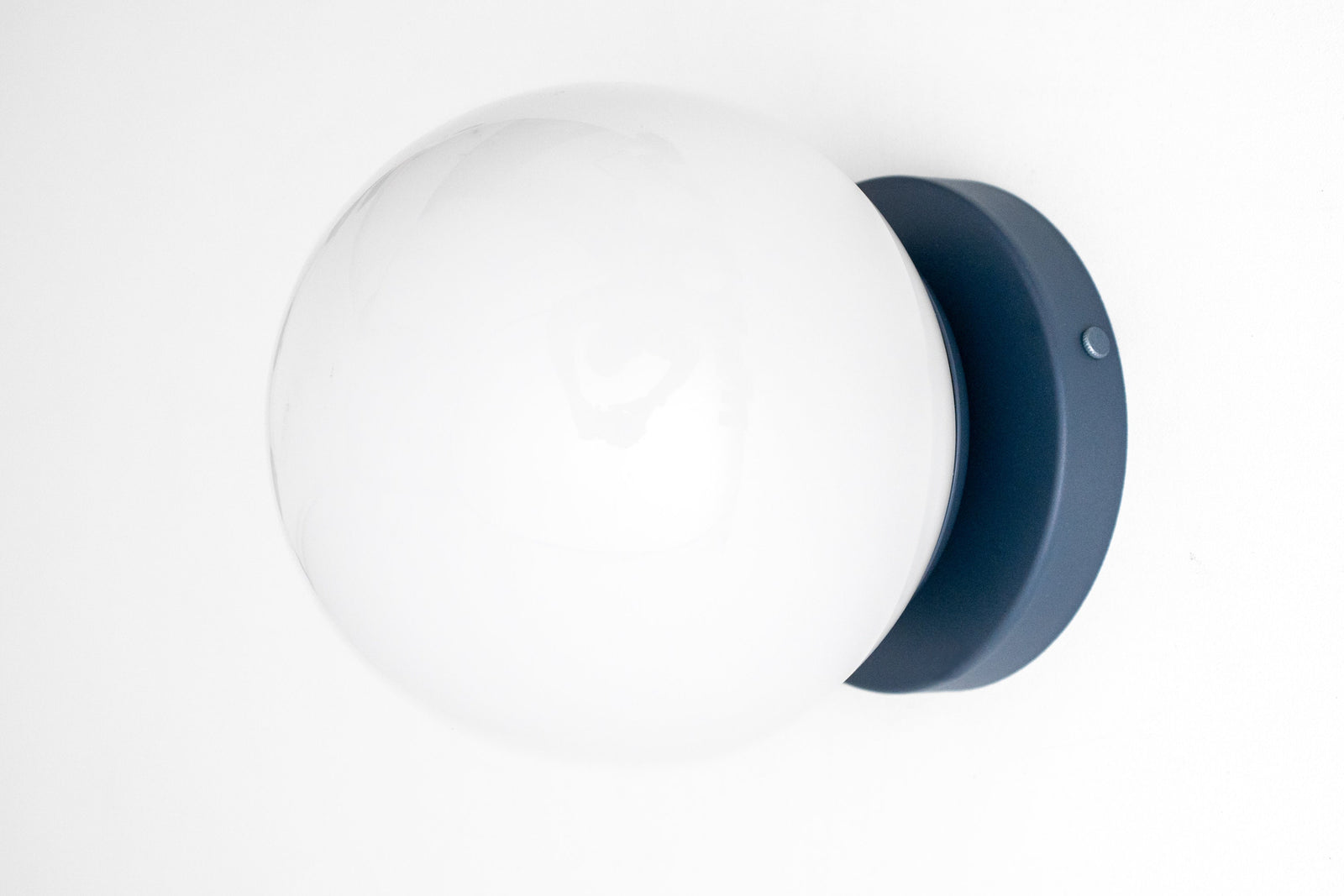 Mid-century modern wall sconce with white globe and coal blue flush mount base. - SCONCE MODEL NO. 3825