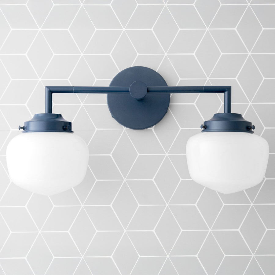 Art Deco style vanity light in coal blue with two round white glass globes and metal wall mount. - VANITY LIGHT MODEL NO. 0276