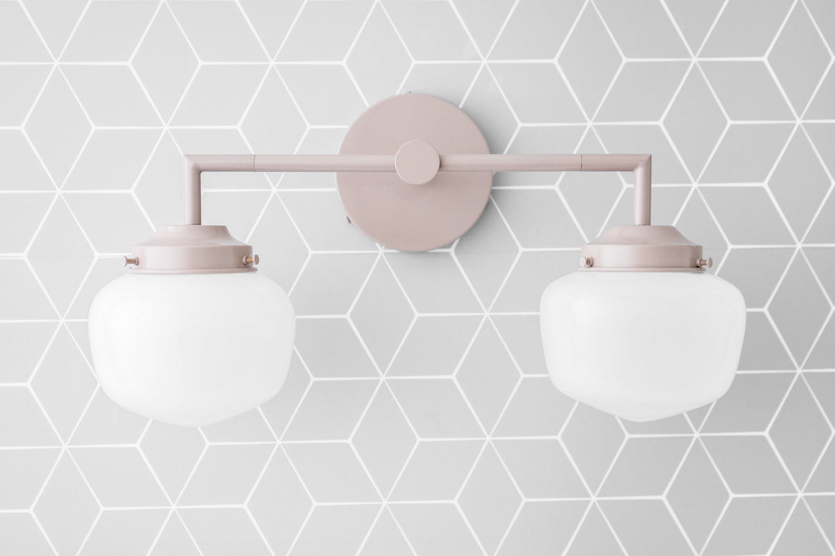 Mauve metal vanity light with two frosted globe bulbs and round wall mount. - VANITY LIGHT MODEL NO. 0276