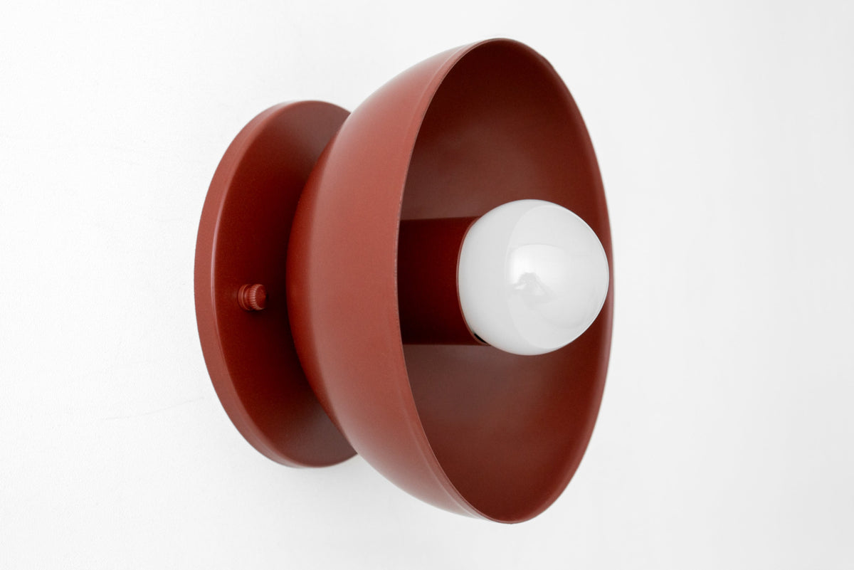 Brick red Scandinavian-style wall sconce with a bare bulb and a flush mount design. - SCONCE MODEL NO. 4812