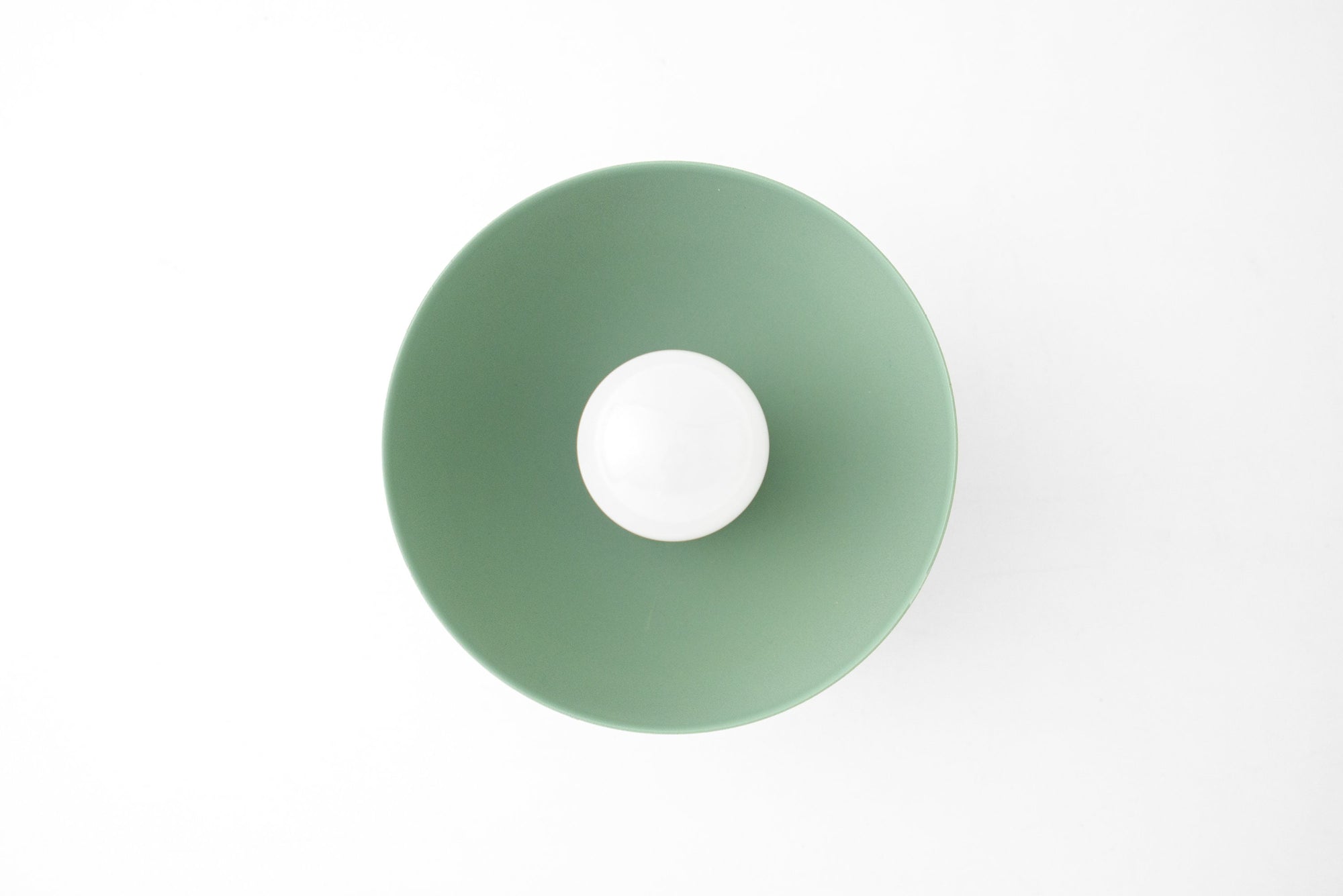Scandinavian-style flush mount sconce in soft green with exposed bulb and matte finish. - SCONCE MODEL NO. 4812