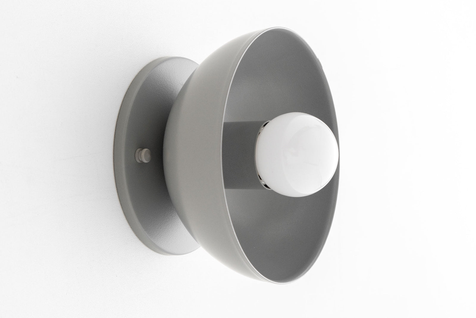 Gray Scandinavian-style wall sconce with exposed bulb and round flush mount. - SCONCE MODEL NO. 4812