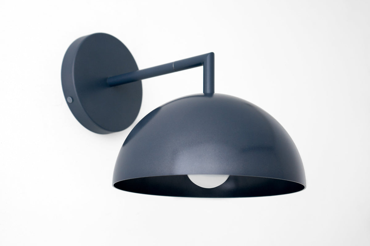 Matte coal blue dome-shaped wall sconce with round backplate and exposed bulb. - SCONCE MODEL NO. 6952