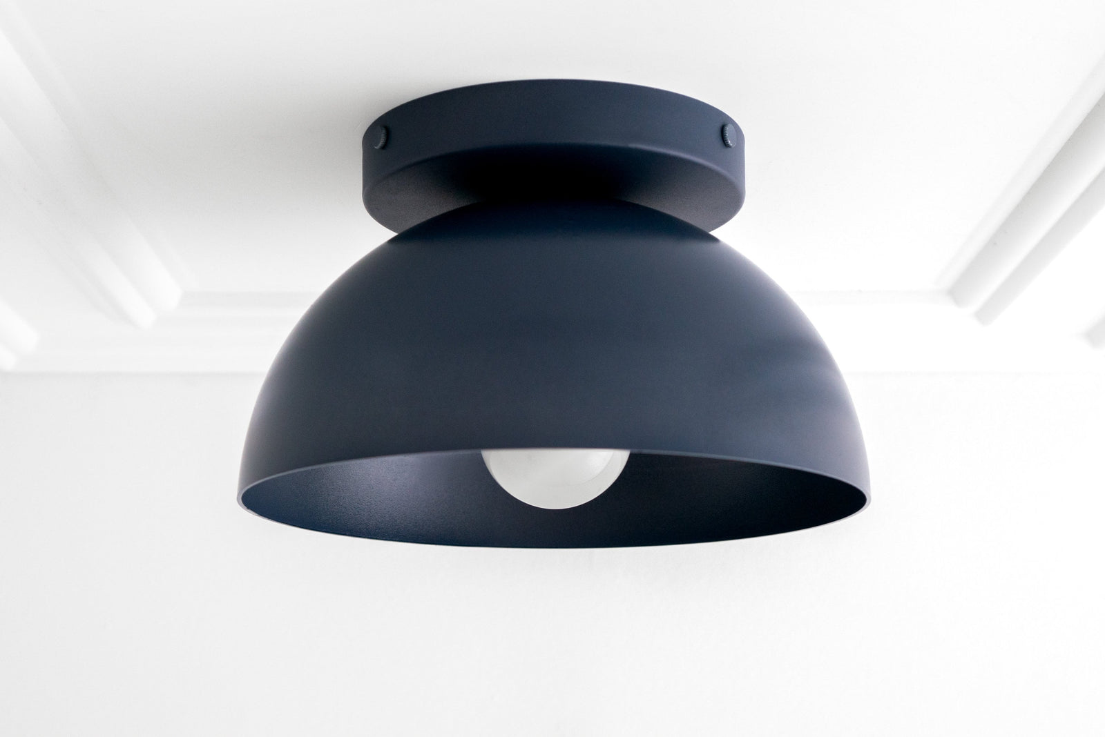 Matte black dome-shaped flush mount ceiling light with exposed bulb opening. - CEILING LIGHT MODEL NO. 9105