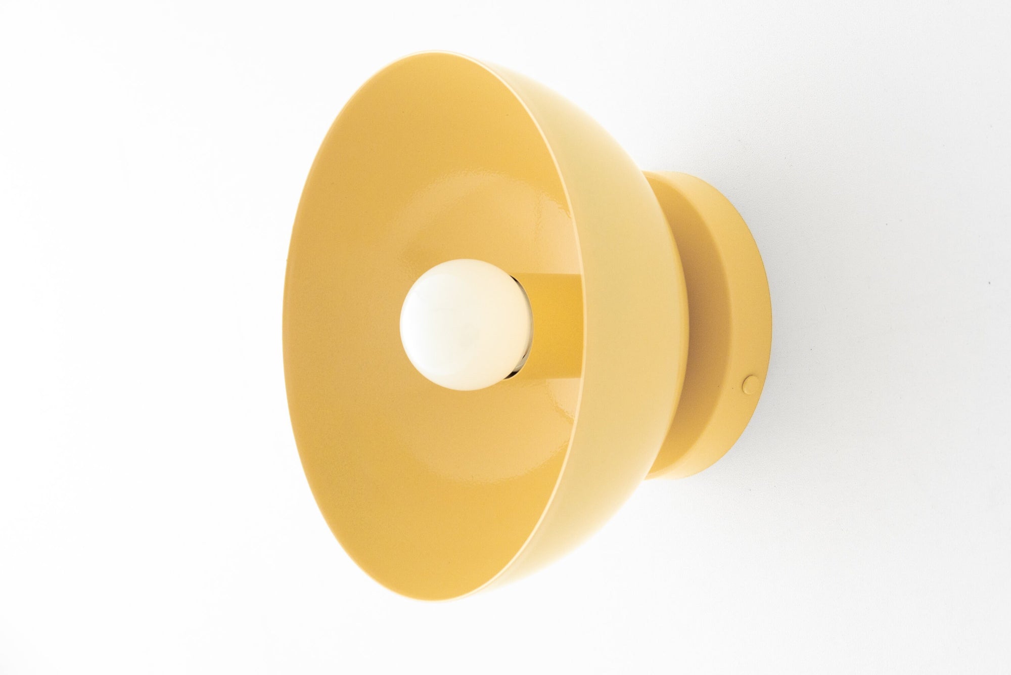 Yellow dome-shaped wall sconce with exposed bulb and matte finish. - SCONCE MODEL NO. 9105