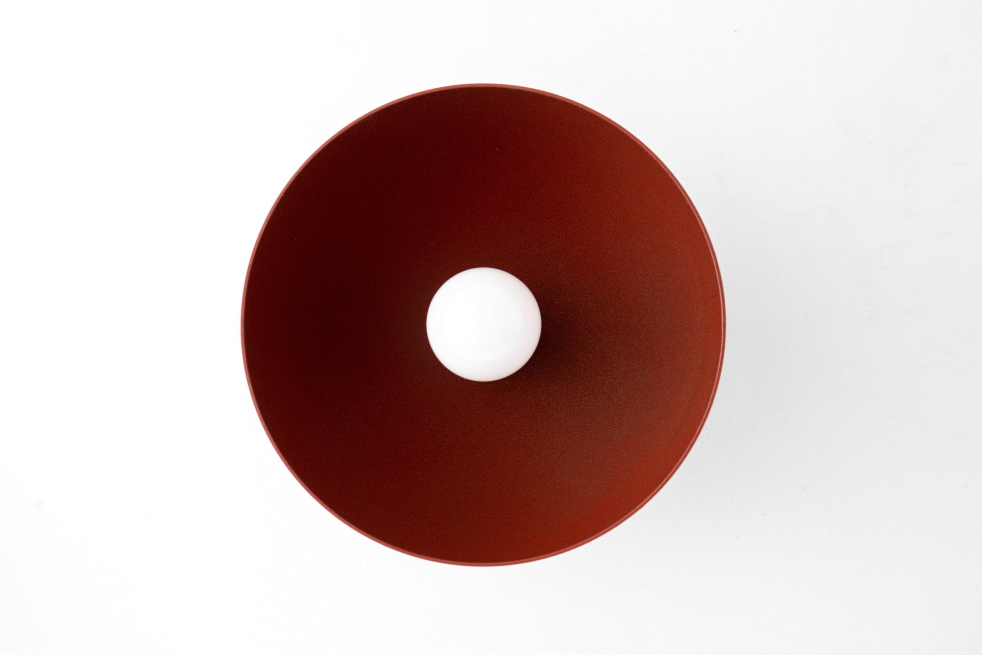 Brick red dome-shaped metal sconce with central bare bulb opening and matte finish. - SCONCE MODEL NO. 9105