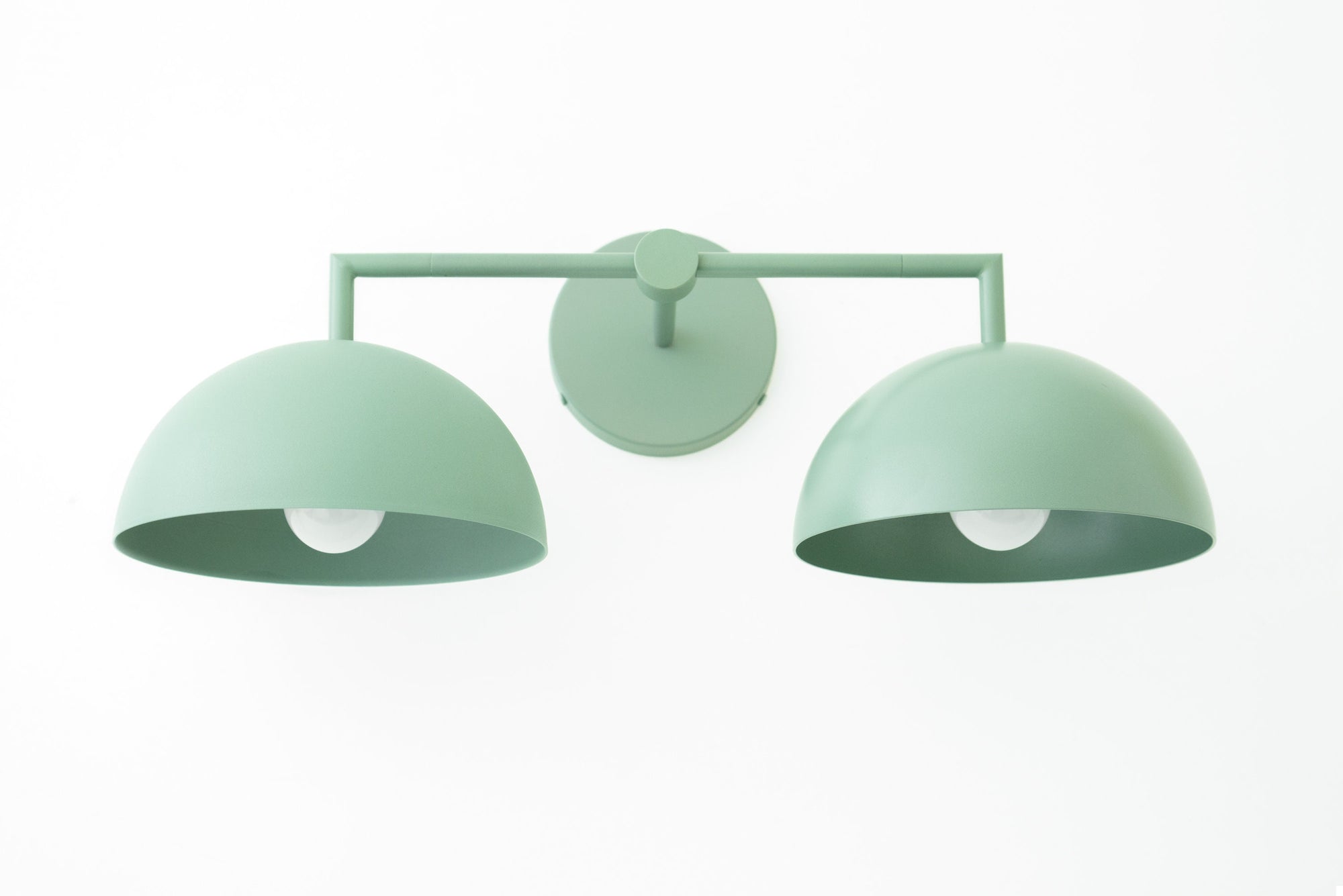 Matte green two-bulb vanity light with dome-shaped shades and minimalist metal frame. - VANITY LIGHT MODEL NO. 6074
