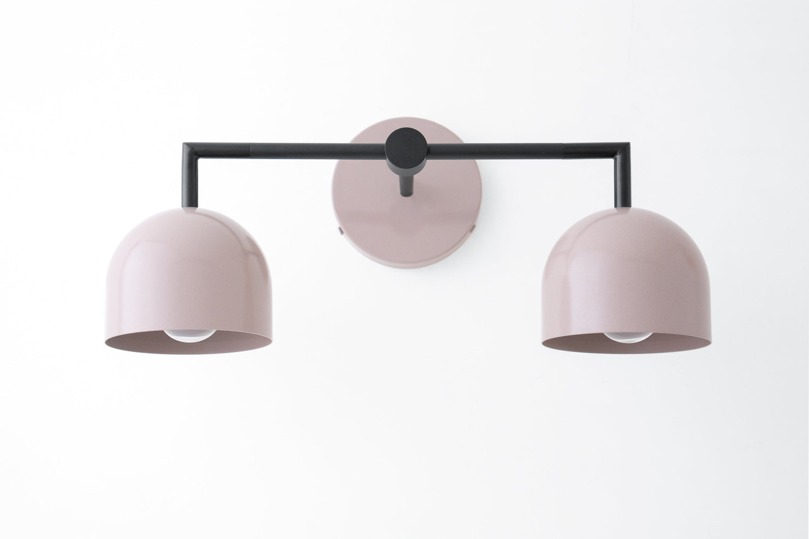 Black metal 2-bulb vanity light with mauve dome shades and round wall mount. - VANITY LIGHT MODEL NO. 8432