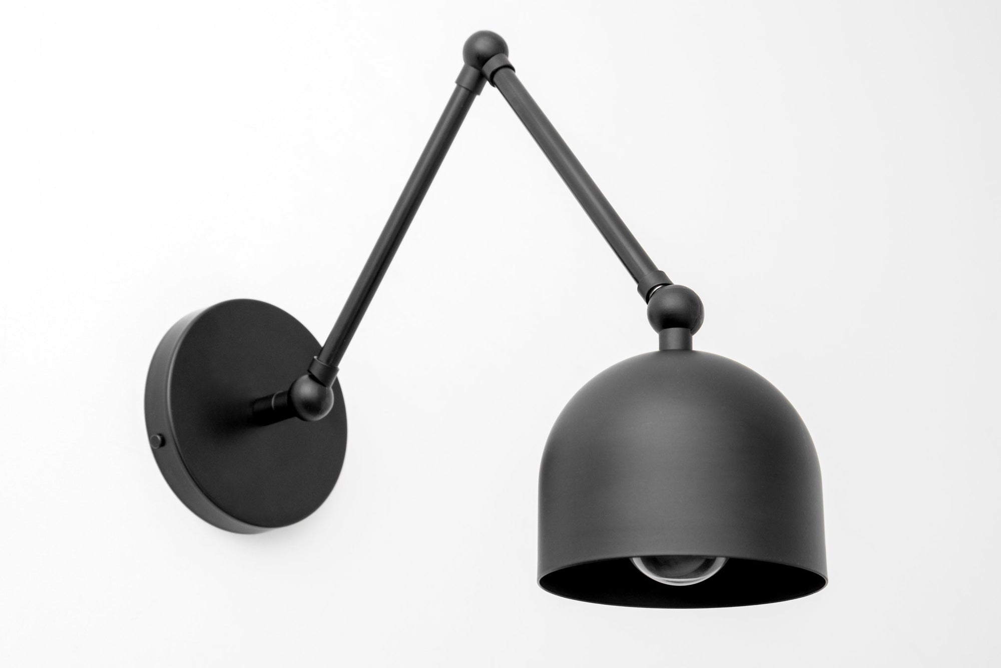 Matte black industrial adjustable wall sconce with dome-shaped shade and jointed arm. - SCONCE MODEL NO. 5998