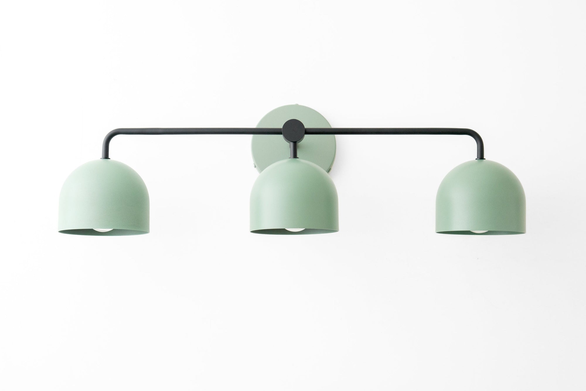 Mid-century modern vanity light with three matte mint green shades and black metal frame. - VANITY LIGHT MODEL NO. 7456