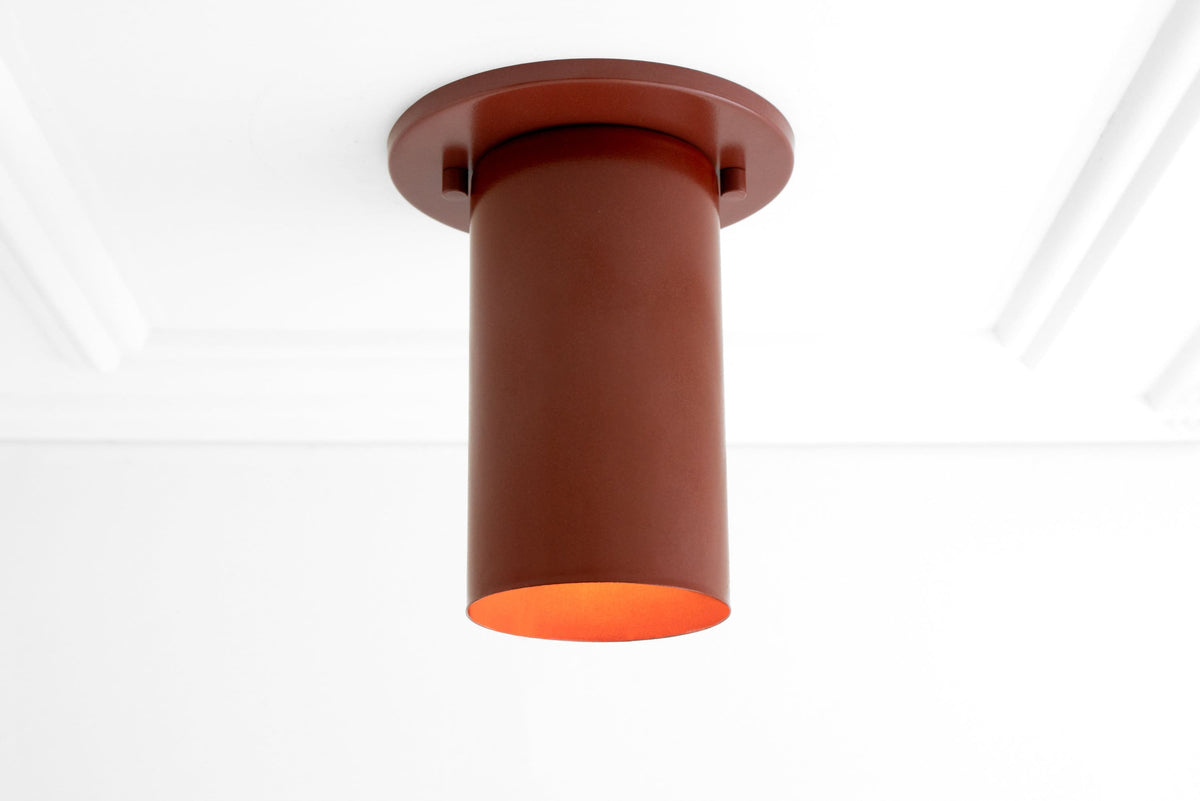 Mid-century modern flush mount ceiling light with cylindrical terracotta shade and warm inner glow. - CEILING LIGHT MODEL NO. 4771
