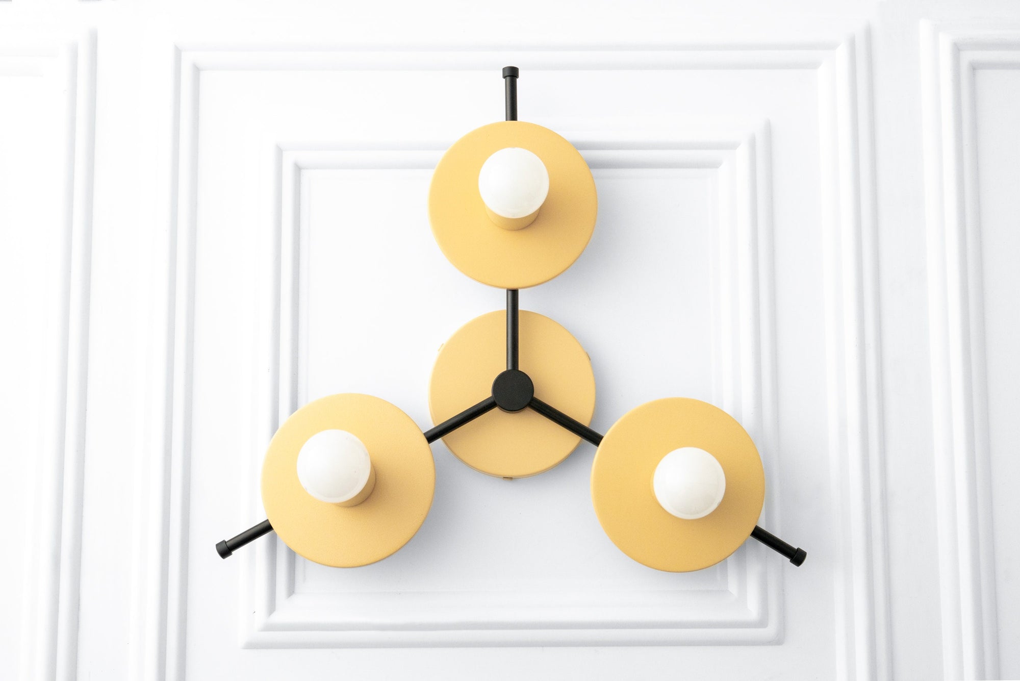 Mid-century modern chandelier with three yellow circular metal shades and exposed white bulbs on black frame. - CHANDELIER MODEL NO. 9526