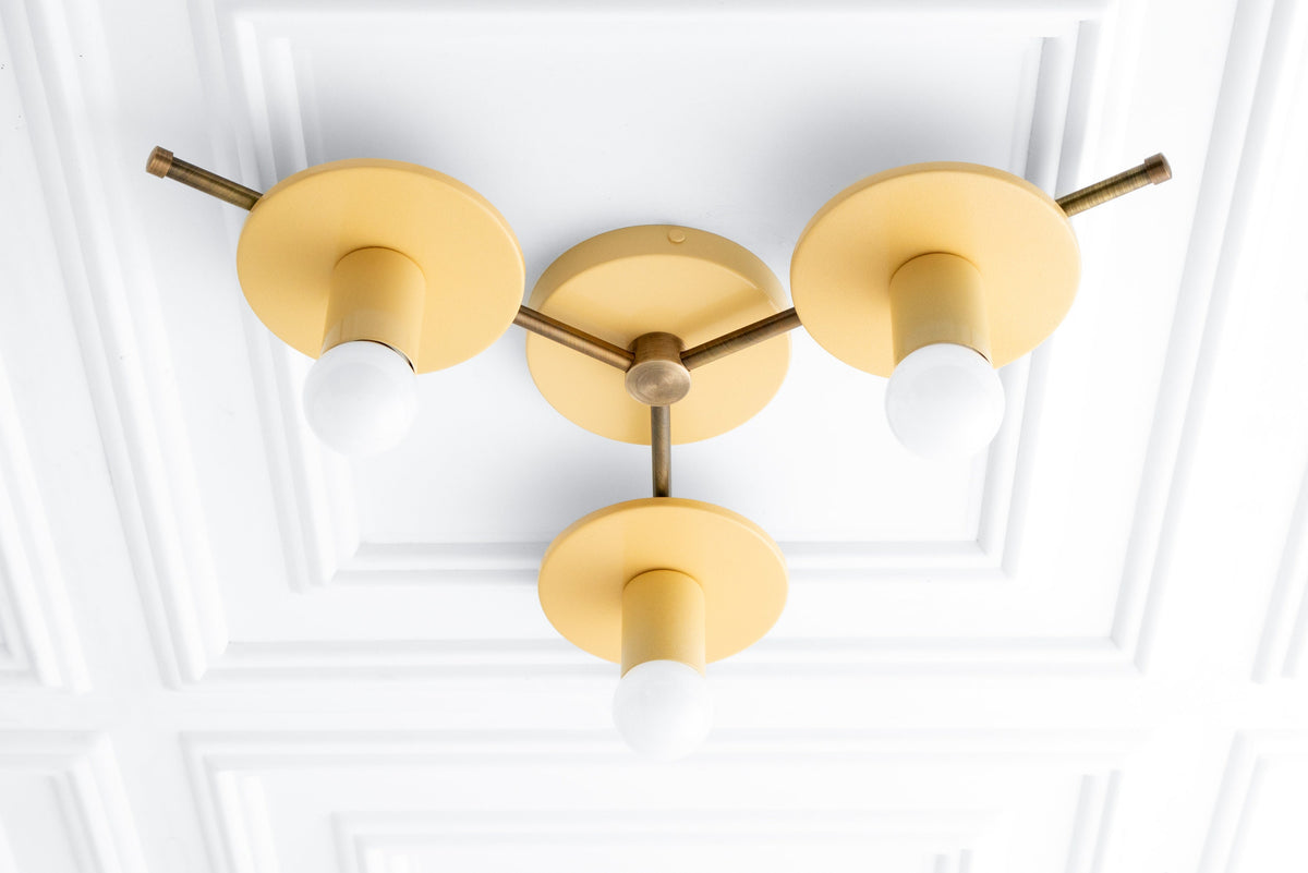 Mid-century modern flush mount chandelier with three round cream-colored shades and antique brass finish. - CHANDELIER MODEL NO. 9526