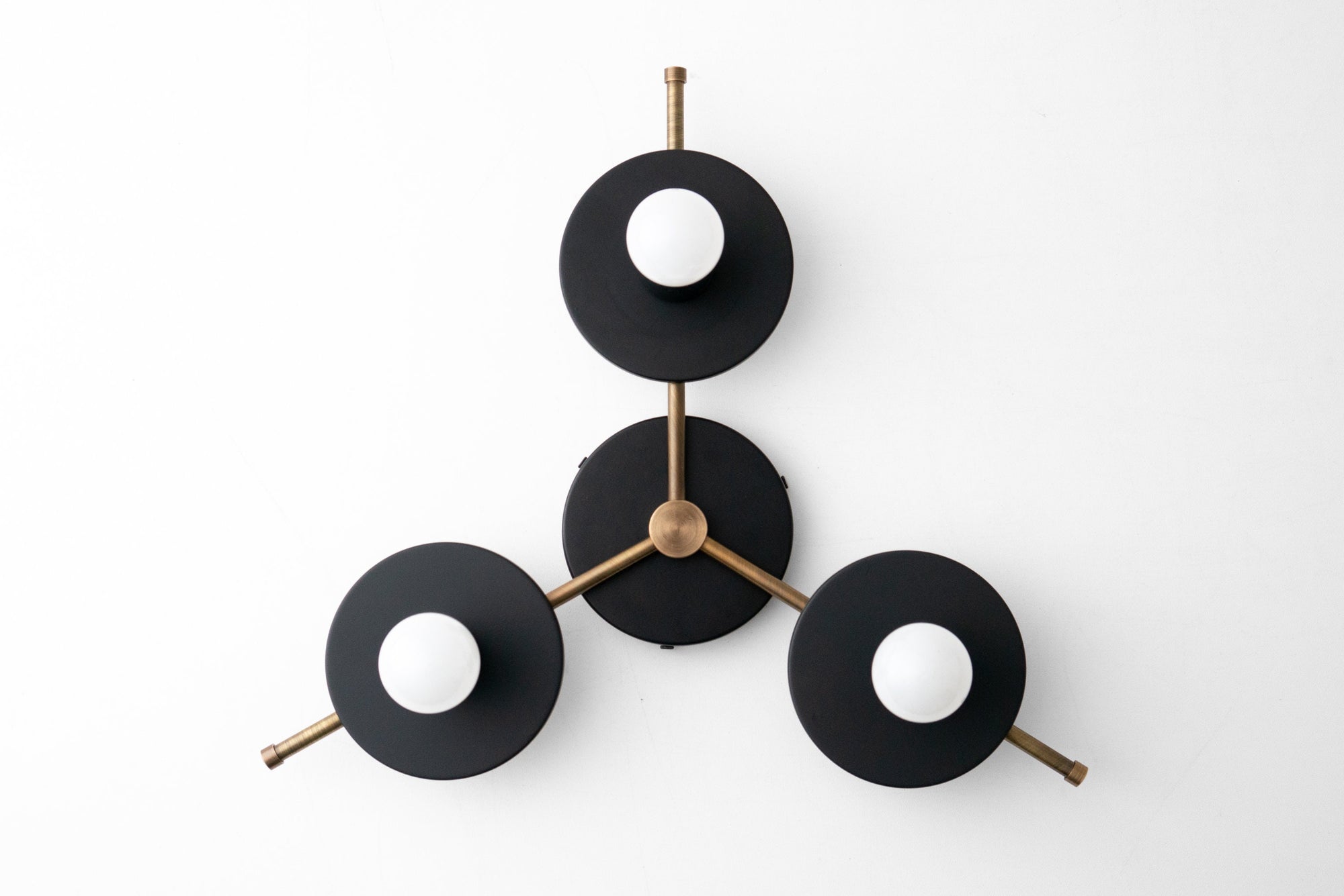 Mid-century modern chandelier with three black disk shades and antique brass arms, flush mount ceiling light. - CHANDELIER MODEL NO. 9526