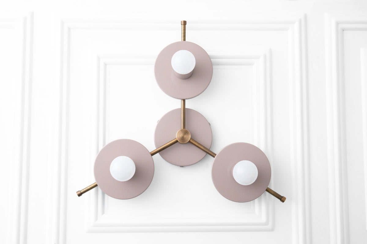 Mid-century modern chandelier with three mauve circular metal shades and antique brass accents. - CHANDELIER MODEL NO. 9526