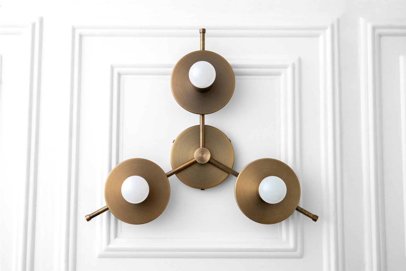 Mid century modern chandelier with three antique brass flush mount bare bulb fixtures on white paneled ceiling. - CHANDELIER MODEL NO. 9526