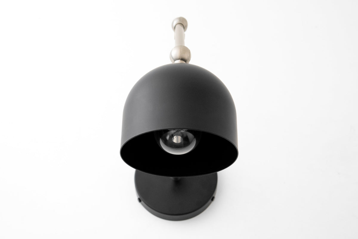 Matte black industrial wall sconce with dome-shaped shade and adjustable arm. - SCONCE MODEL NO. 5998