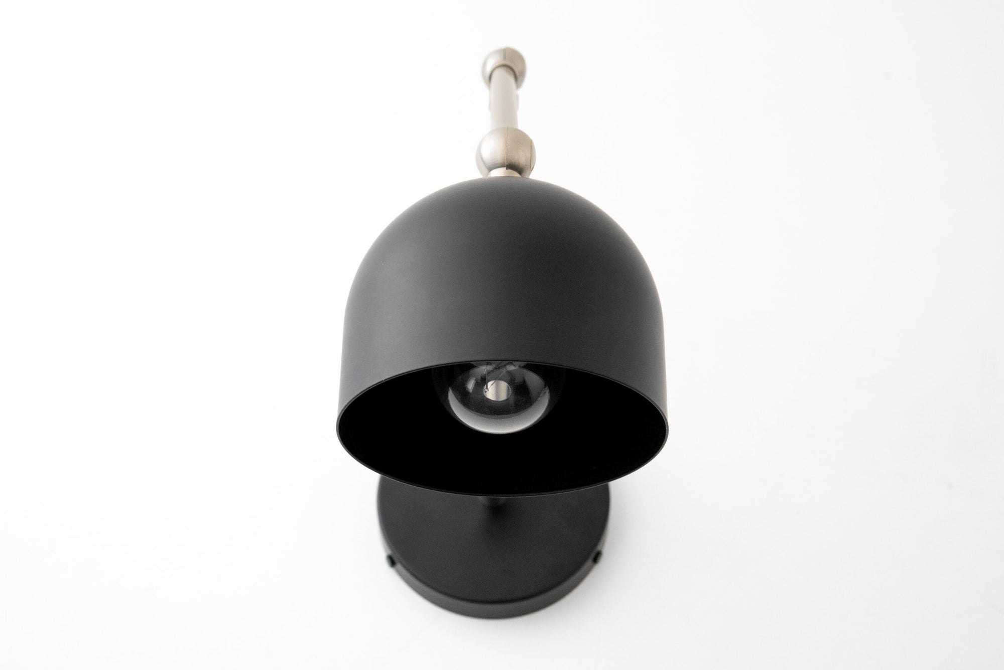 Matte black industrial wall sconce with dome-shaped shade and adjustable arm. - SCONCE MODEL NO. 5998