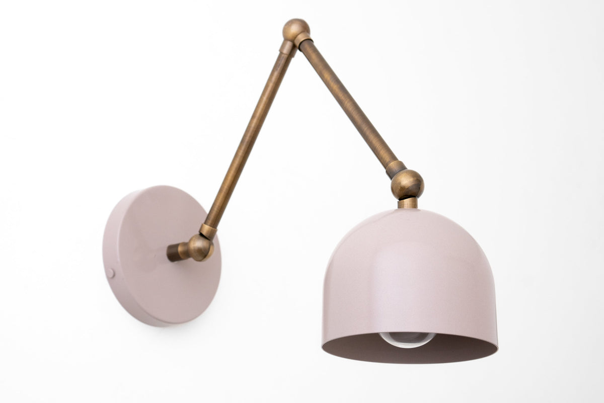 Adjustable antique brass industrial wall sconce with mauve dome shade and round wall mount. - SCONCE MODEL NO. 5998