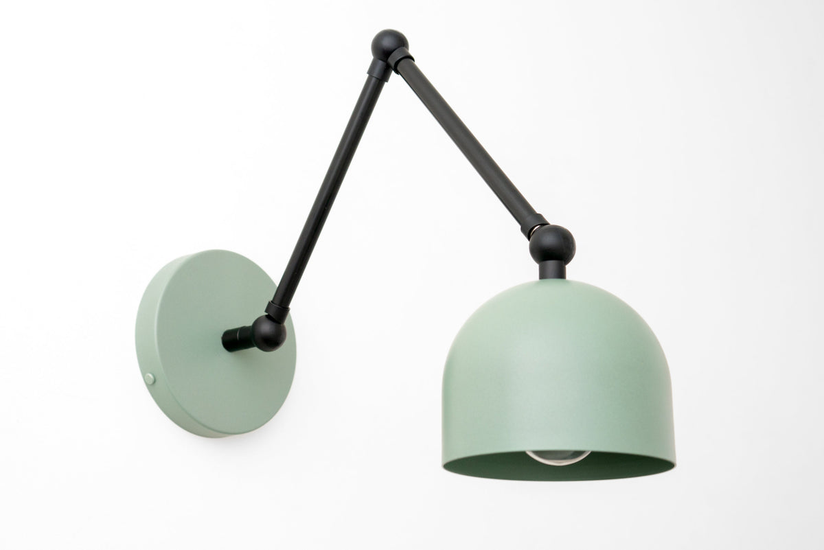 Matte black adjustable arm wall sconce with muted green dome shade and round wall mount. - SCONCE MODEL NO. 5998
