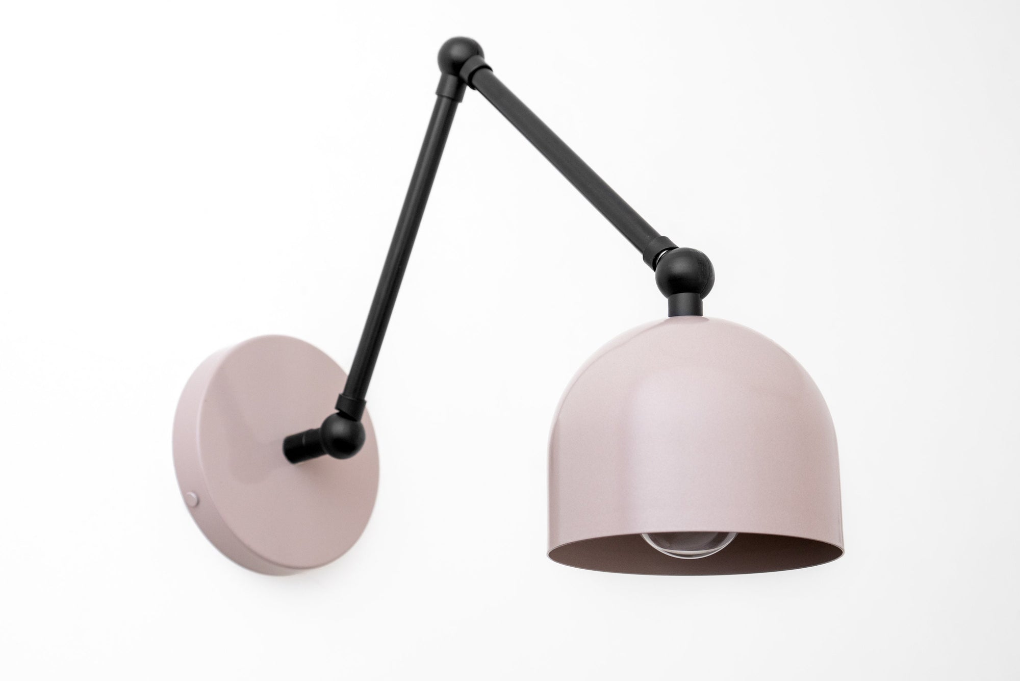 Black adjustable industrial sconce with a mauve dome-shaped metal shade and round wall mount. - SCONCE MODEL NO. 5998