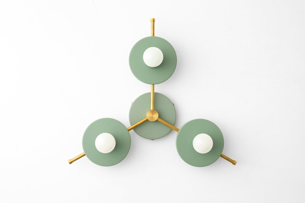 Mid-century modern chandelier with three raw brass arms and green circular shades, flush mount design. - CHANDELIER MODEL NO. 9526