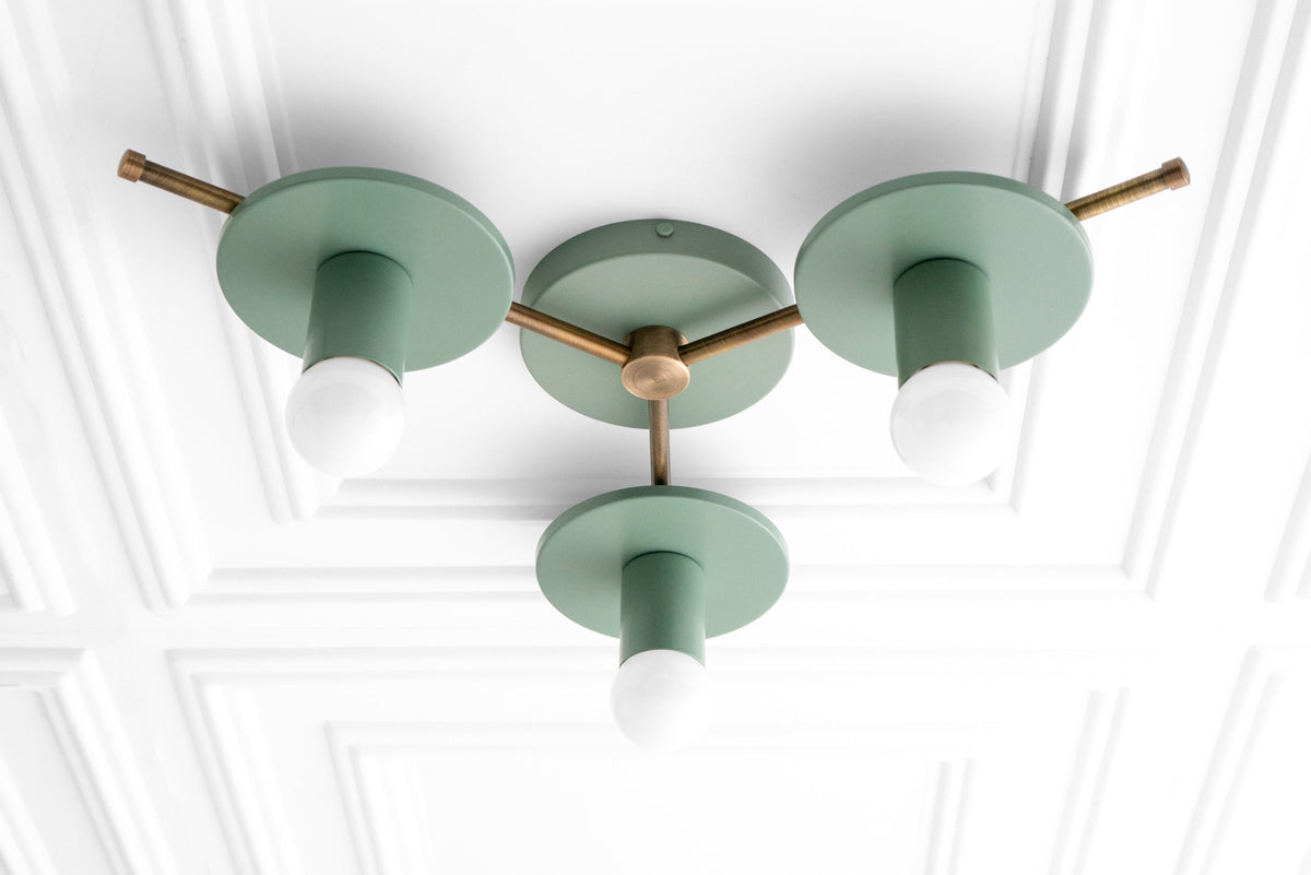 Mid-century modern flush mount chandelier with three green matte shades and antique brass accents. - CHANDELIER MODEL NO. 9526