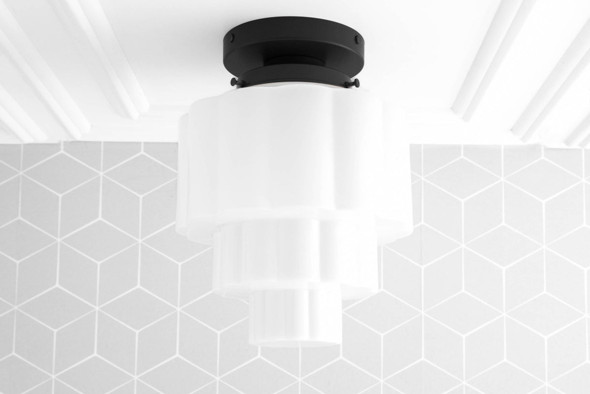 Art Deco flush mount ceiling light with layered white glass globes and black base. - CEILING LIGHT MODEL NO. 3602