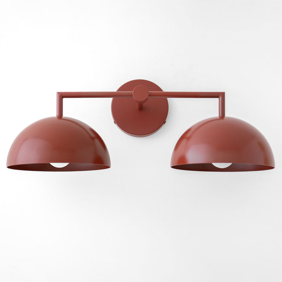 Brick red dome-shaped double vanity light with matte finish and minimalist metal frame. - VANITY LIGHT MODEL NO. 6074