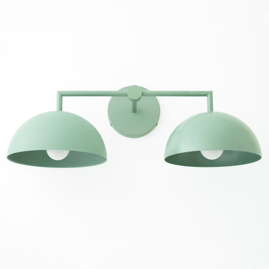 Matte green dome-shaped double vanity light with minimalist metal frame and round wall mount. - VANITY LIGHT MODEL NO. 6074