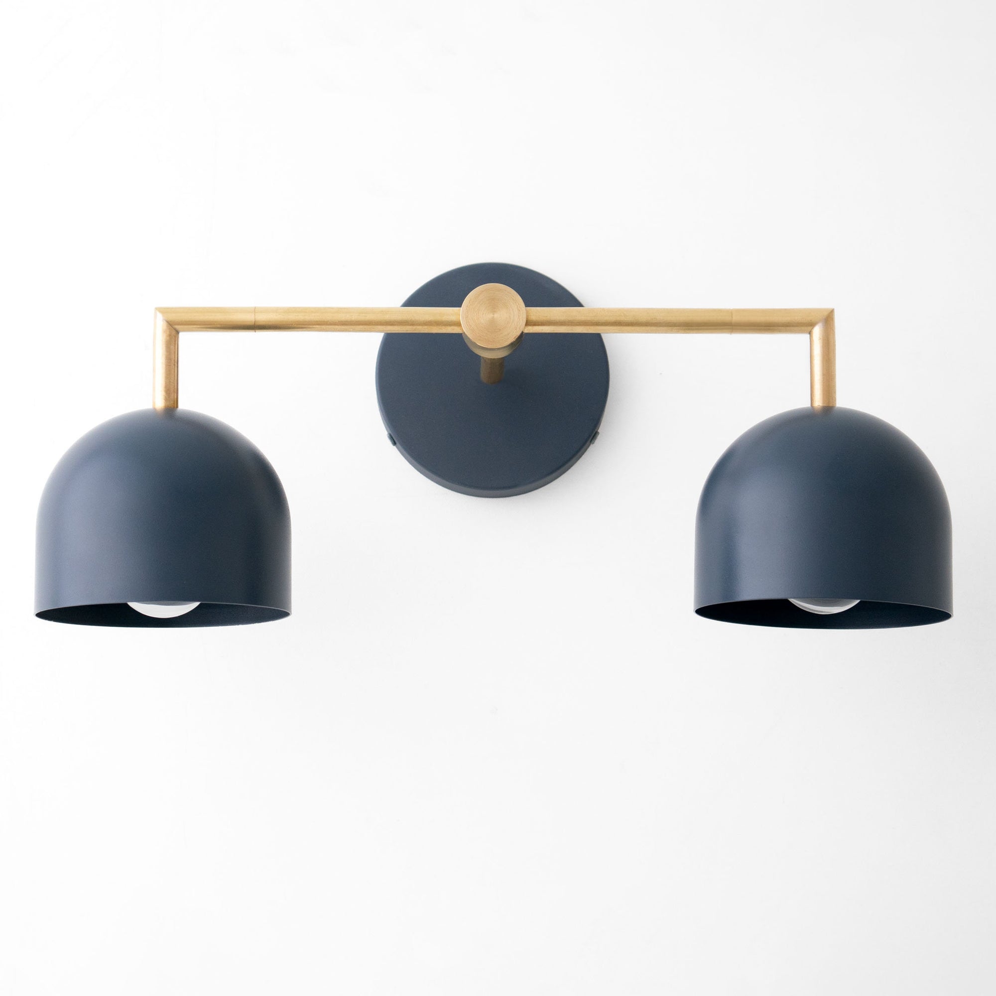 Art Deco vanity light with two coal blue dome shades and raw brass horizontal bar and round mount. - VANITY LIGHT MODEL NO. 8432