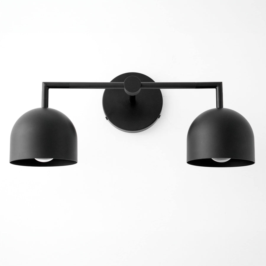 Black matte double dome shade vanity light with horizontal bar and round wall mount. - VANITY LIGHT MODEL NO. 8432
