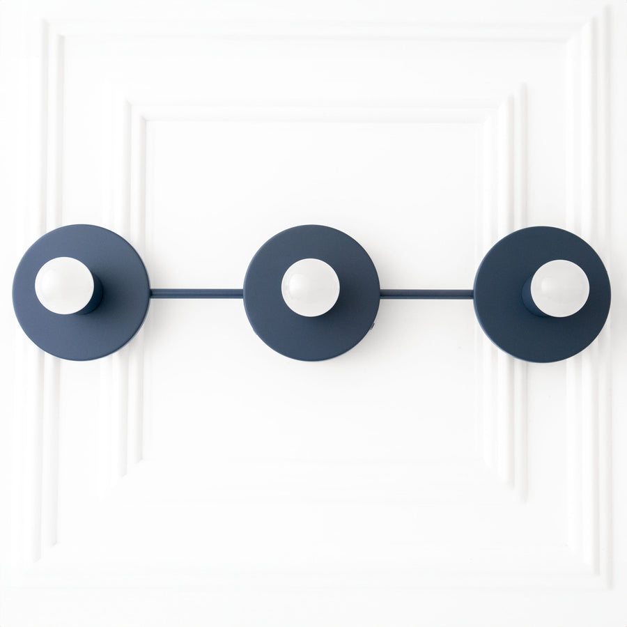 Coal blue three-bulb vanity light fixture with minimalist round metal shades and exposed bulbs. - VANITY LIGHT MODEL NO. 5708