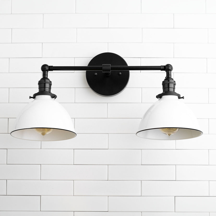Black industrial 2-bulb vanity light with white metal shades and round wall mount. - VANITY LIGHT MODEL NO. 4564