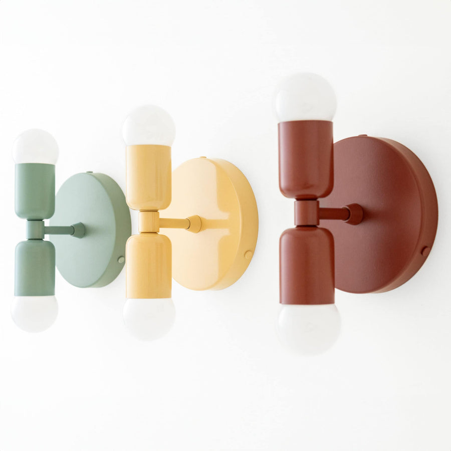 Set of three mid-century modern double-bulb wall sconces in green, yellow, and reddish brown with matte finish. - SCONCE MODEL NO. 2660