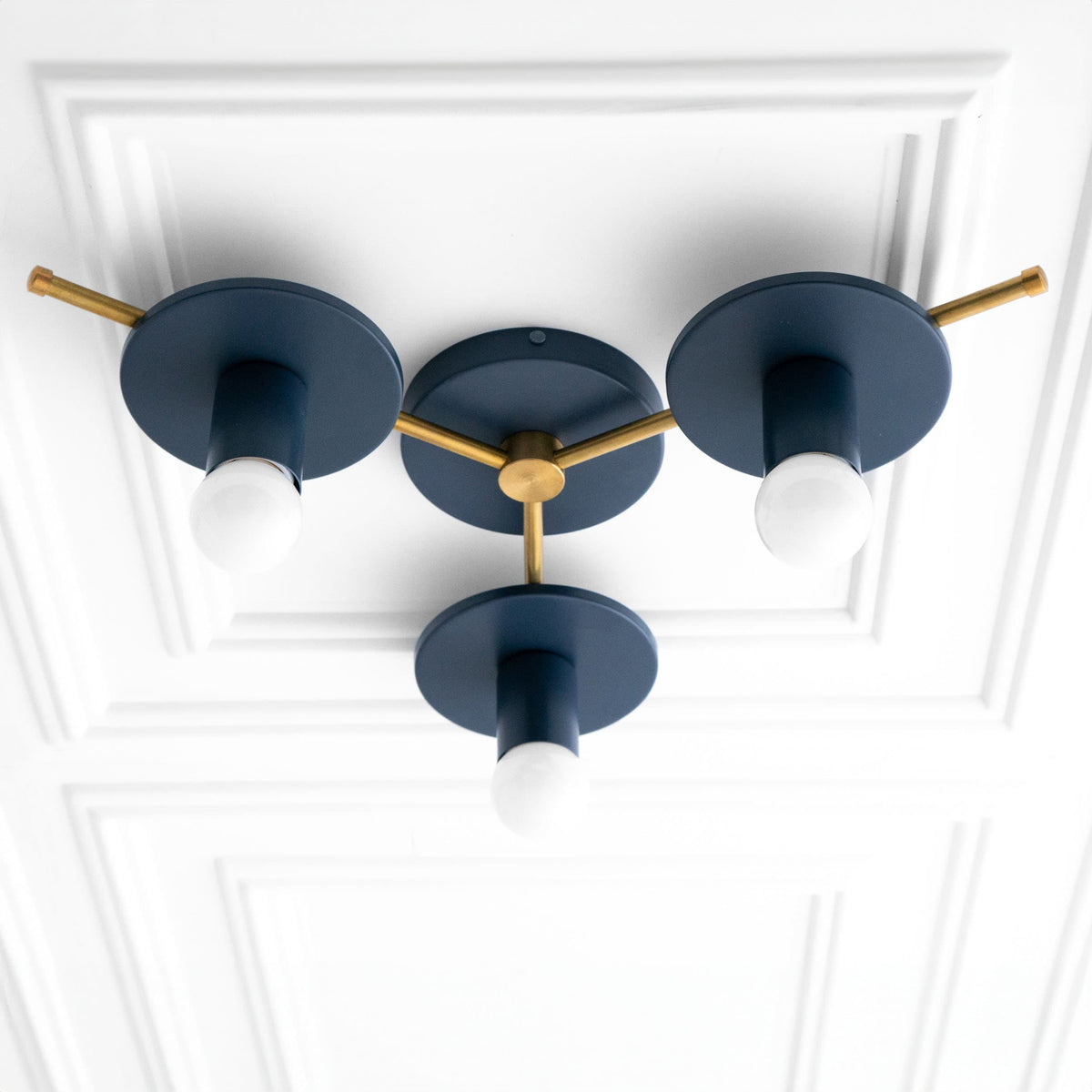 Mid-century modern flush mount chandelier with three coal blue metal shades and raw brass arms and fixtures. - CHANDELIER MODEL NO. 9526