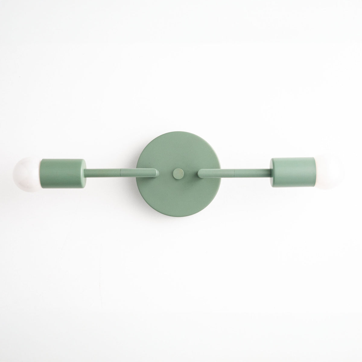 Mid-century modern green vanity light with two exposed bulbs and round wall mount. - VANITY LIGHT MODEL NO. 1938