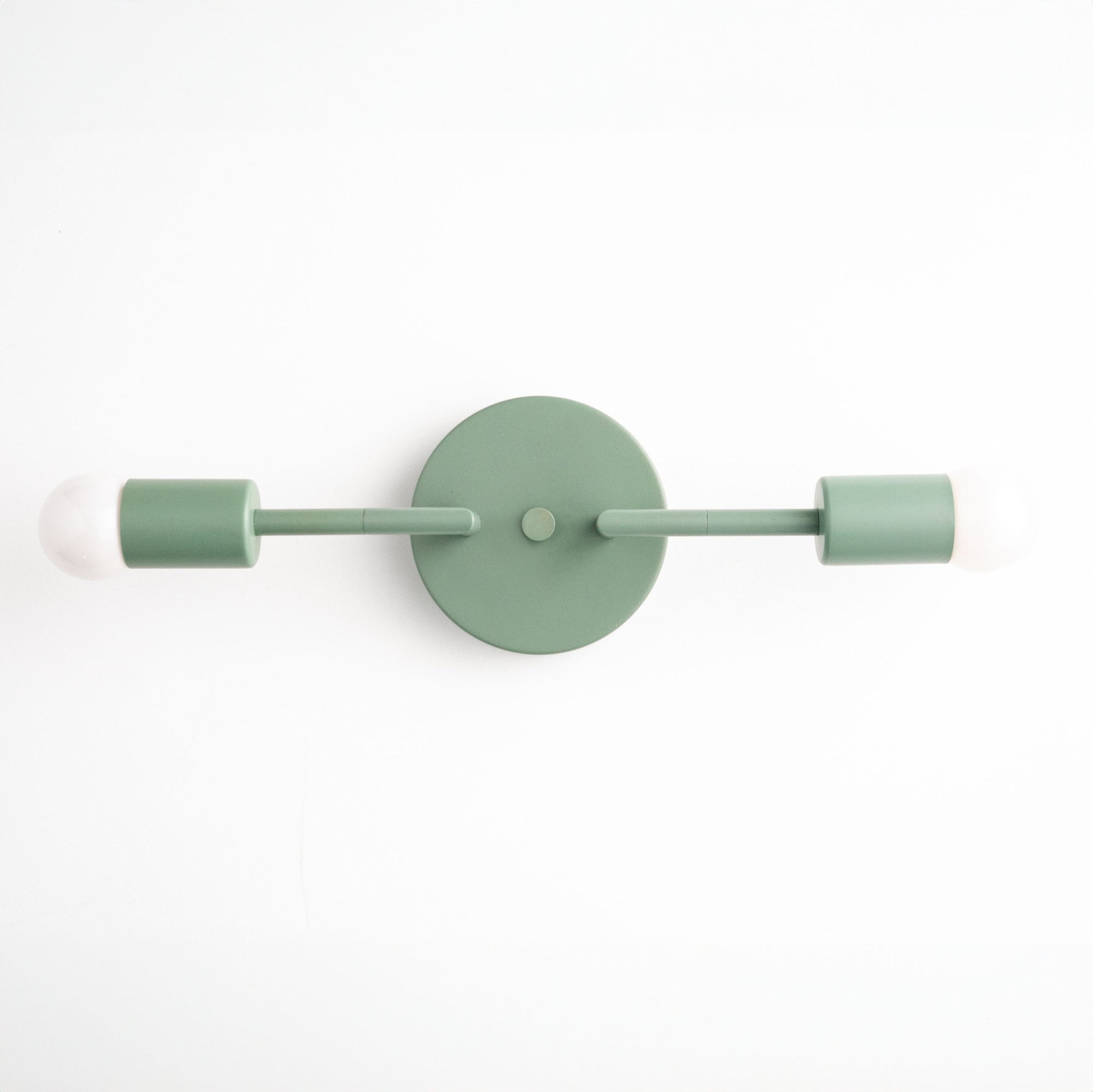 Mid-century modern green vanity light with two exposed bulbs and round wall mount. - VANITY LIGHT MODEL NO. 1938